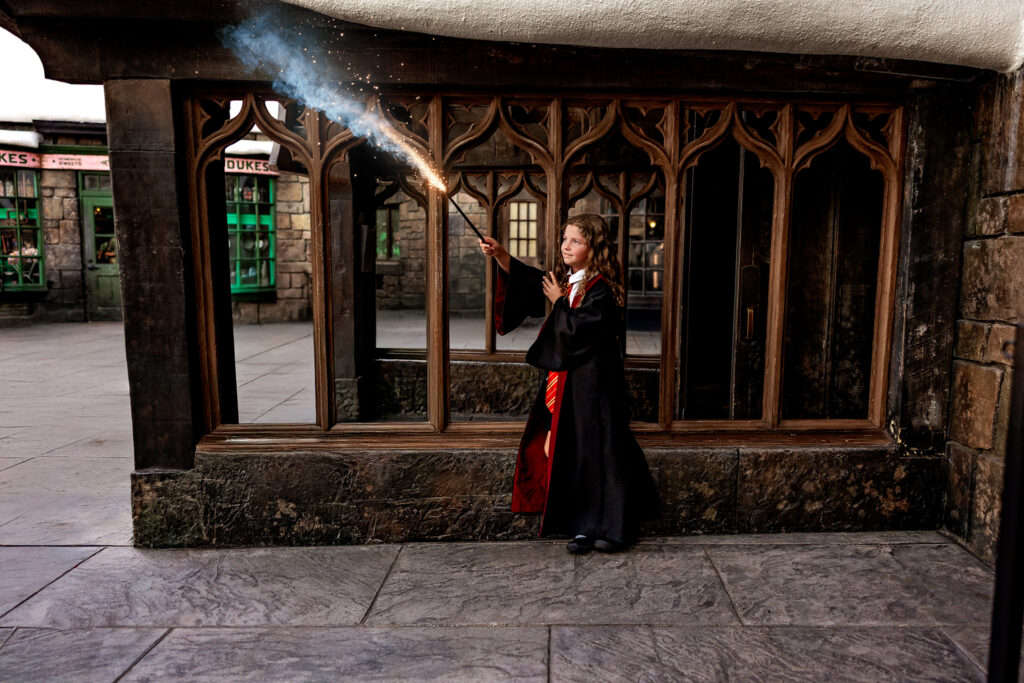 Young witch casts her spell in the Wizarding World at Universal Orlando Resort