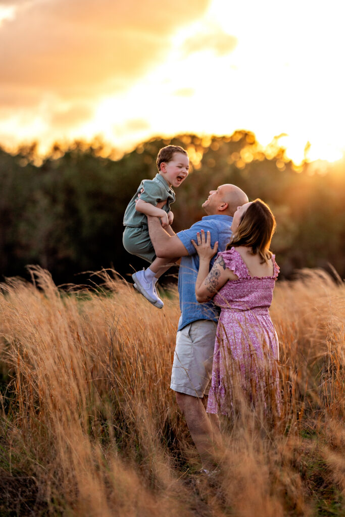 Dani, Gary, and Henry Littles posing together in the beautiful meadows of Lake Louisa State Park, Central Florida