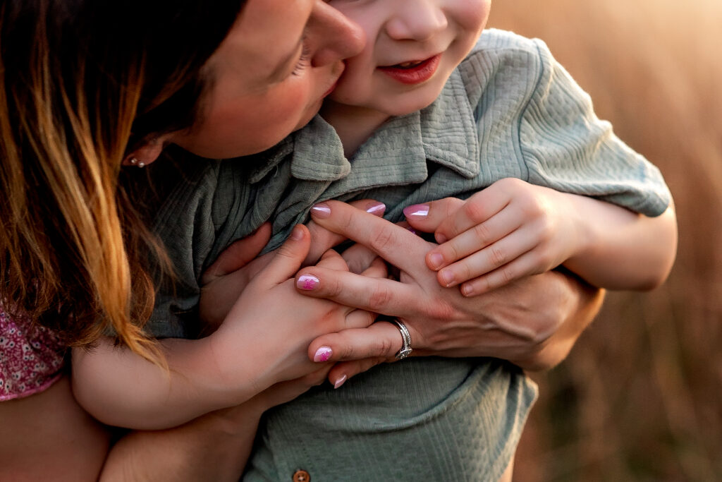 Dani Littles hugging her son Henry at Lake Louisa State Park in Clermont, Florida