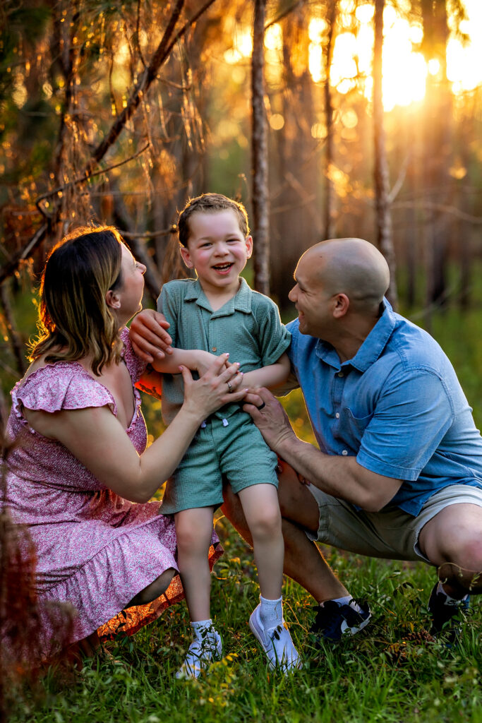 Heartwarming moment between Dani, Gary, and Henry during their vacation family session in Clermont, Florida