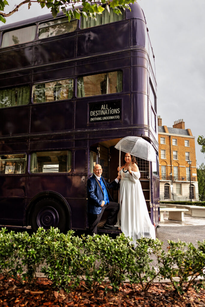 Bride with a clear umbrella beside the Knight Bus at Universal Orlando