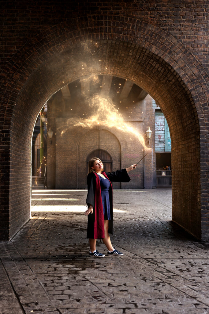Jayda casts a spell inside an archway at Diagon Alley in Universal Orlando