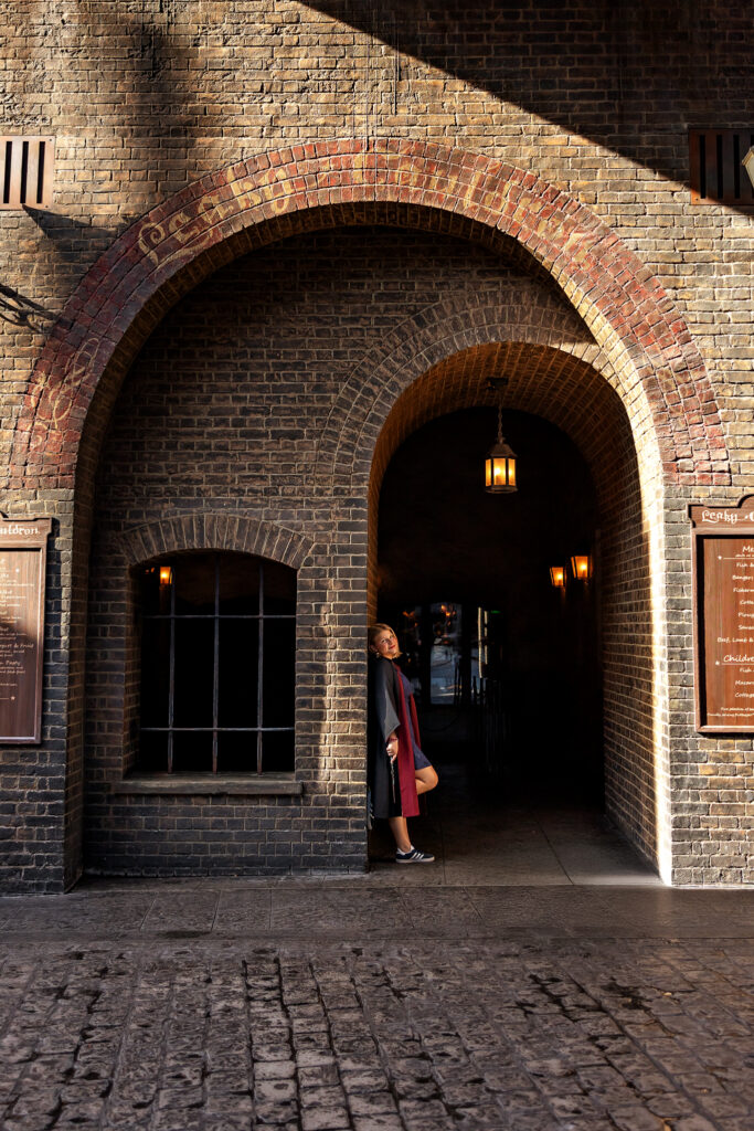 Jayda stands at the entrance of the Leaky Cauldron at Universal Orlando