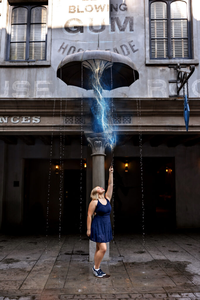 Jayda casts a spell under the umbrella inside Diagon Alley