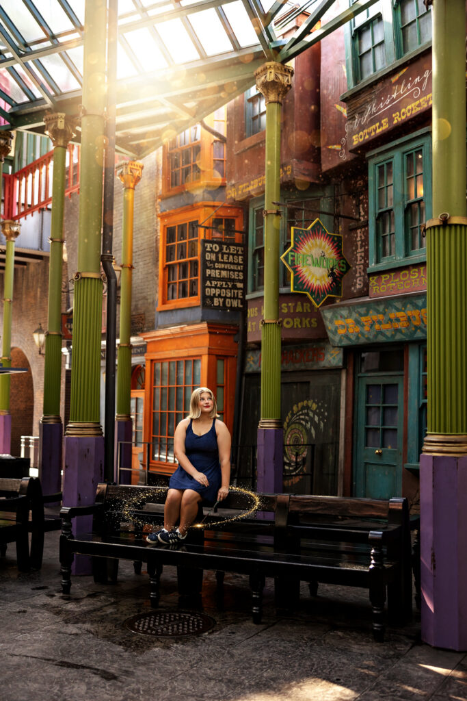Jayda sits inside an empty Diagon Alley inside the Wizarding World at Universal Orlando