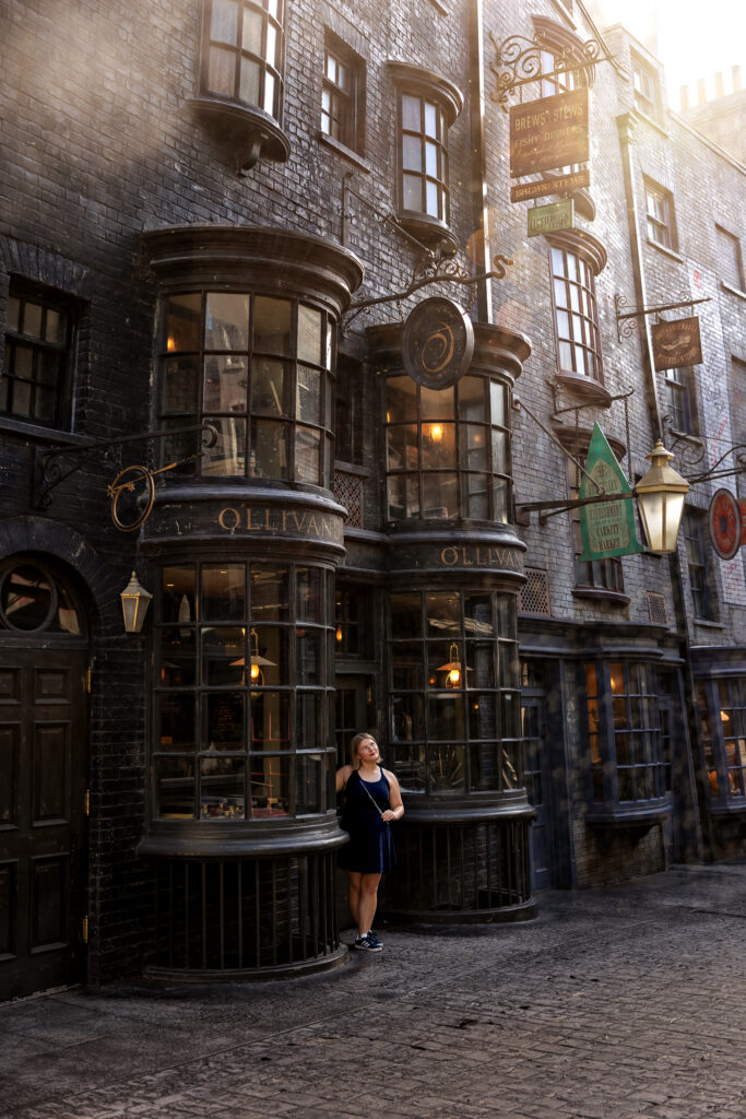 Jayda stands by Ollivander's Wand Shop