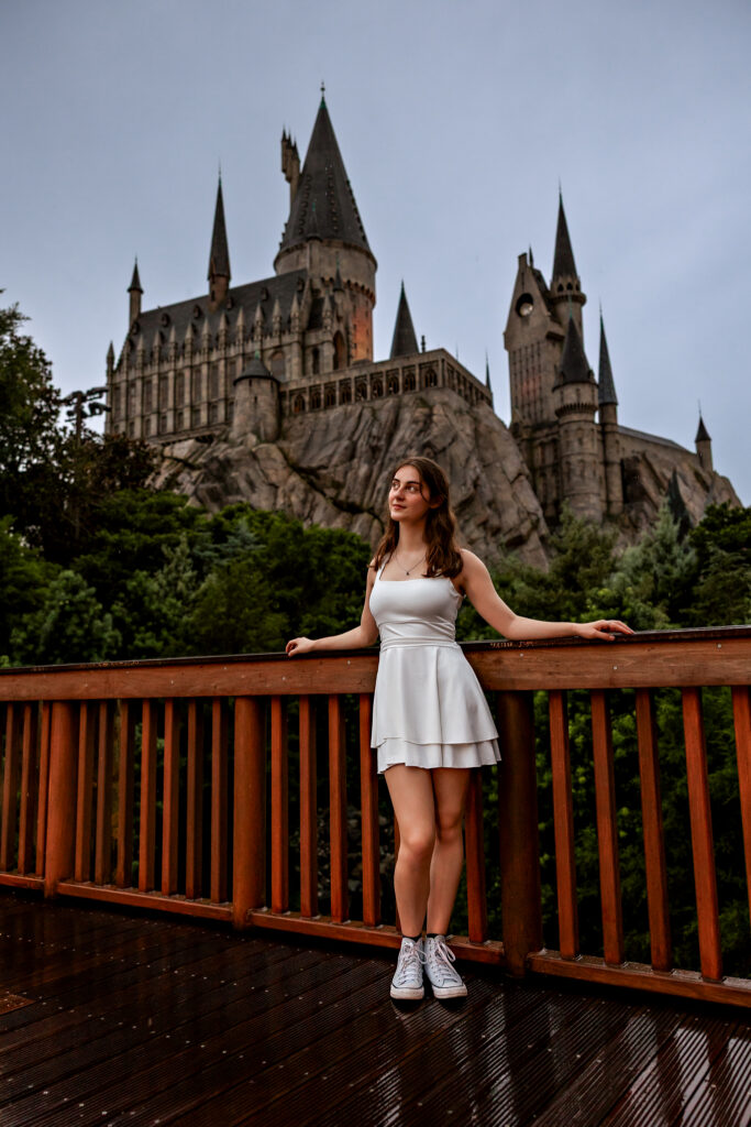 Soft, overcast senior portrait of Madison on the streets of Hogsmeade